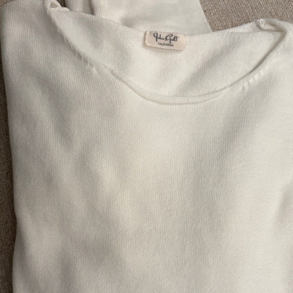Off white long sleeve knit top.